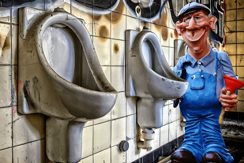 animated plumber in the bathroom with urinals