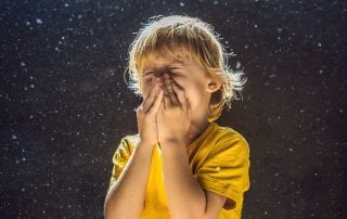small child sneezing